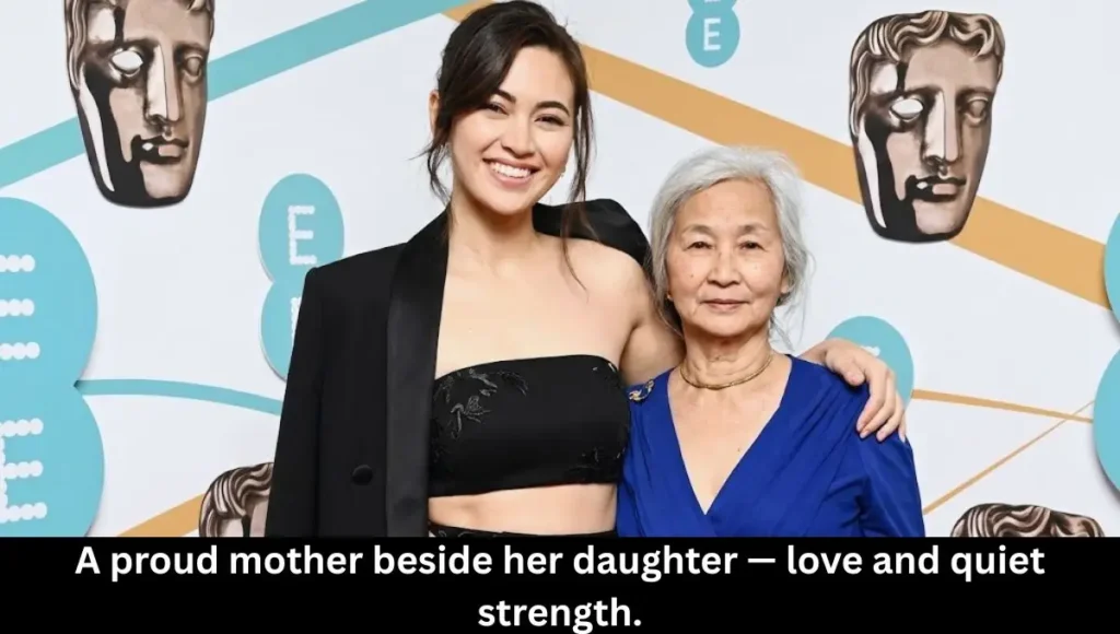A proud mother standing beside her accomplished daughter — a timeless symbol of love, heritage, and quiet strength.